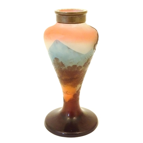 208 - A Galle glass vase with tree and landscape decoration. Approx 6 1/4