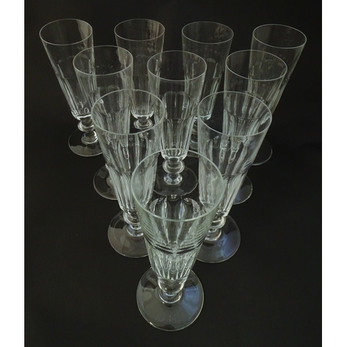 209 - Ten Saint Louis crystal champagne flutes, marked under ' St Louis Cristal France' Approx 7 1/4