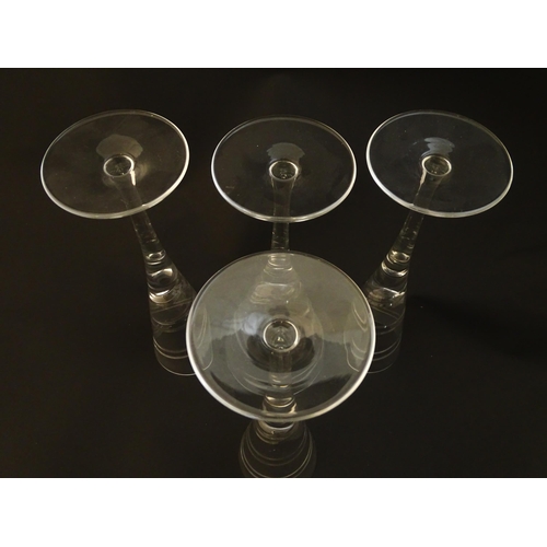 211 - A set of four champagne flutes Approx 10 1/2