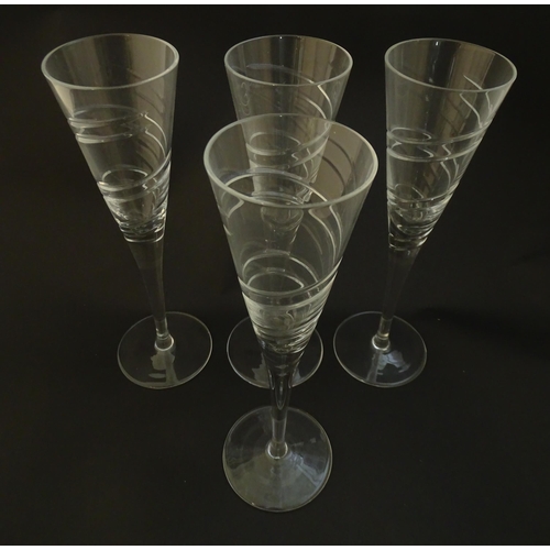 211 - A set of four champagne flutes Approx 10 1/2