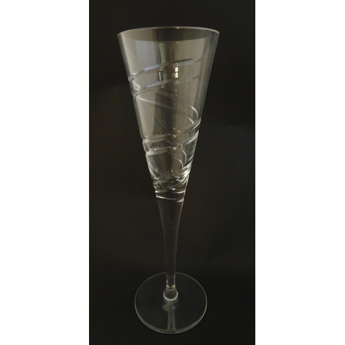 211 - A set of four champagne flutes Approx 10 1/2