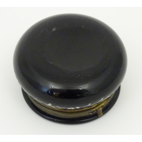 214 - A small black glass pot wit hinged lid having Mary Gregory detail to top. 2