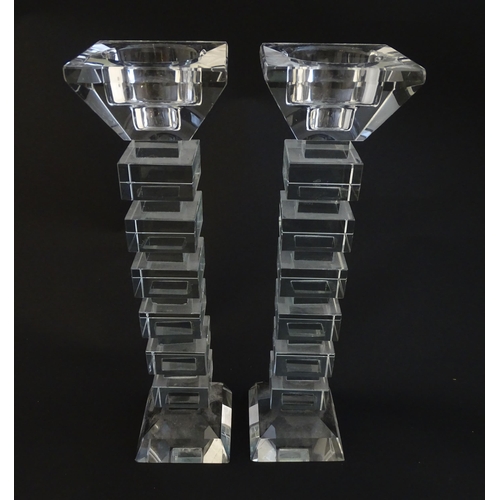 221 - A pair of glass candlesticks with geometric squared detail. Approx 8 1/2