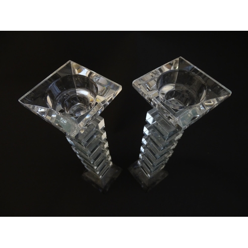 221 - A pair of glass candlesticks with geometric squared detail. Approx 8 1/2