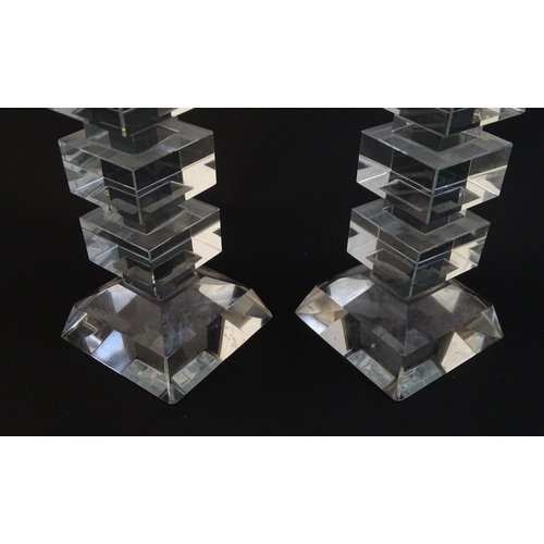 221 - A pair of glass candlesticks with geometric squared detail. Approx 8 1/2