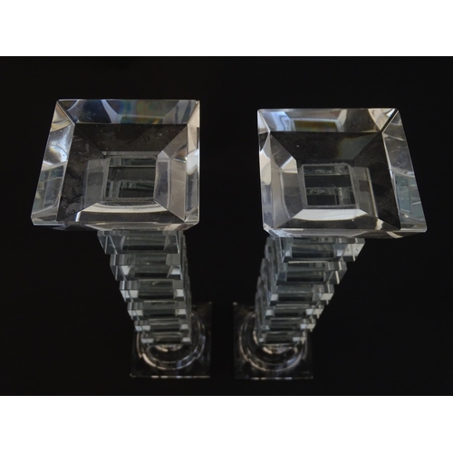 221 - A pair of glass candlesticks with geometric squared detail. Approx 8 1/2