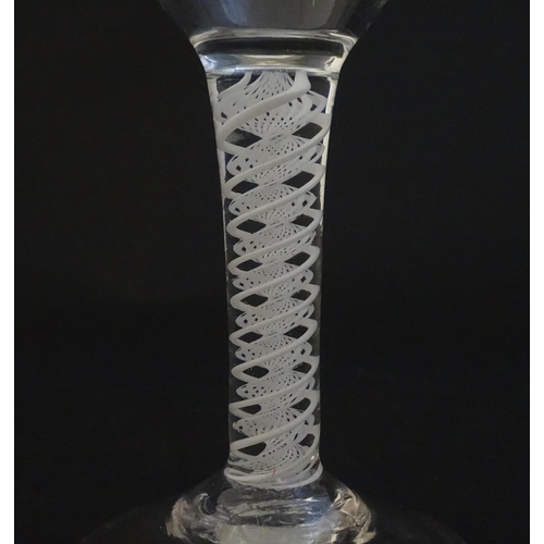 250A - A 19thC pedestal drinking glass with twist detail to stem. Approx 5