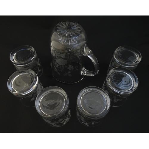 251 - A glass water jug and 6 glasses with engraved floral detail. The Jug approx 7 1/4