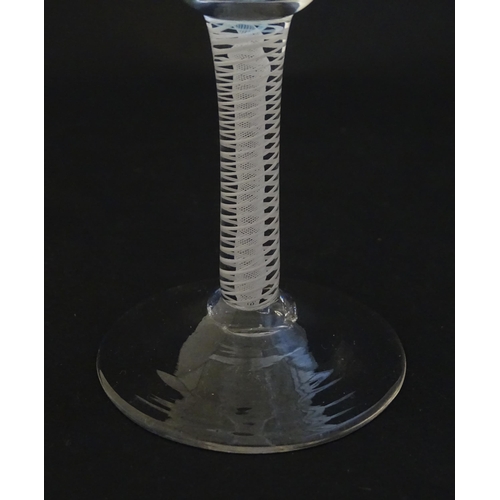 252A - A 19thC pedestal drinking glass with twist detail to stem. Approx 4 1/4