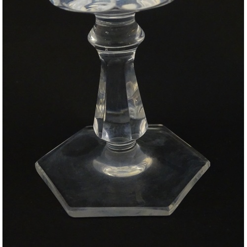 257 - Eight pedestal drinking glasses on a hexagonal foot. Approx 6 1/4