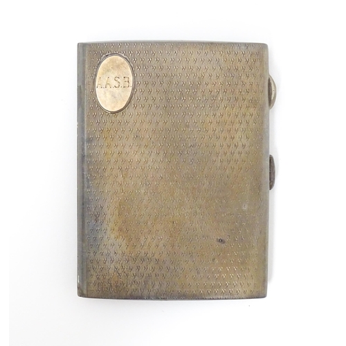 267 - A silver cigarette case with engine turned decoration and gilded interior, hallmarked Chester 1911 m... 