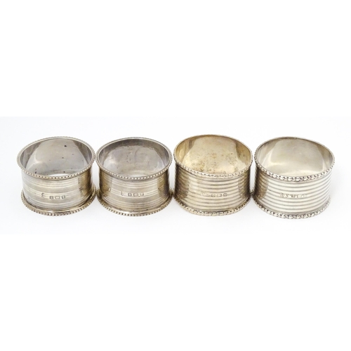 269 - Two silver napkin rings hallmarked Birmingham 1918 maker Martin Hall & Co ltd. Together with two nap... 