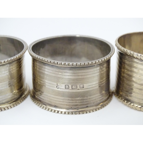 269 - Two silver napkin rings hallmarked Birmingham 1918 maker Martin Hall & Co ltd. Together with two nap... 