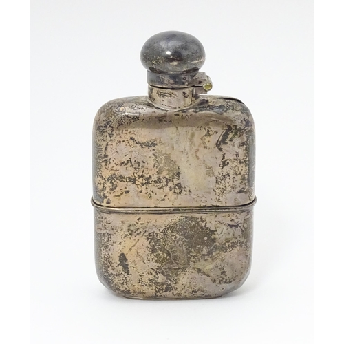 271 - A Victorian silver hip flask. With engraved squirrel armorial. Hallmarked Sheffield 1898 maker G & J... 