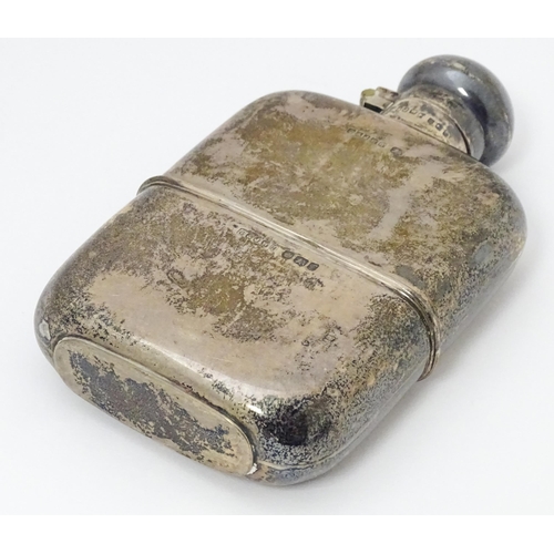 271 - A Victorian silver hip flask. With engraved squirrel armorial. Hallmarked Sheffield 1898 maker G & J... 