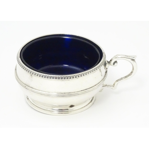 273 - A silver salt with blue glass liner hallmarked Birmingham 1919 maker Collingwood & Sons Ltd.