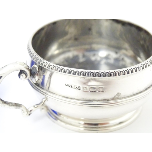 273 - A silver salt with blue glass liner hallmarked Birmingham 1919 maker Collingwood & Sons Ltd.