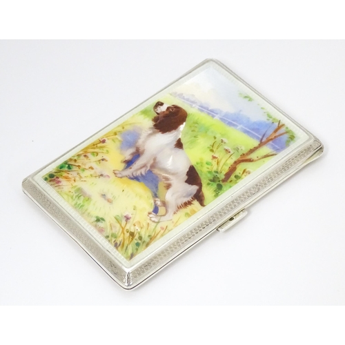 275 - An Art Deco silver cigarette case with enamel Spaniel dog decoration, engine turned detail and gilde... 