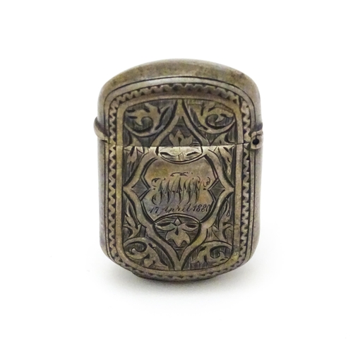 281 - A Victorian silver vesta case with engraved decoration. Maker Hillard & Thomason 1 1/2