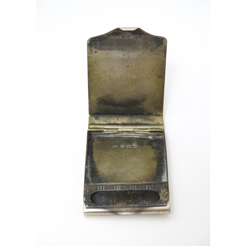 282 - A silver match box sleeve with engine turned decoration, hallmarked London 1919 maker Edwin Henry Wa... 