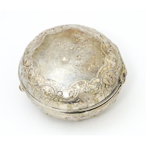 284 - A Continental white metal pot of circular form with hinged lid. Approx 2 1/4