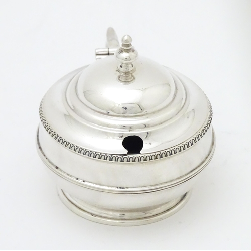 285 - A silver mustard pot with blue glass liner hallmarked Birmingham 1919 maker Collingwood & Sons Ltd. ... 