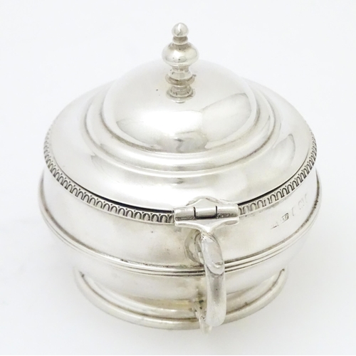 285 - A silver mustard pot with blue glass liner hallmarked Birmingham 1919 maker Collingwood & Sons Ltd. ... 