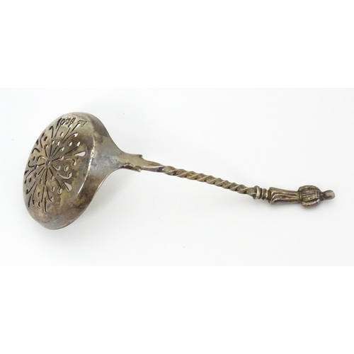 289 - A Victorian silver sifter spoon with apostle handle. Hallmarked Sheffield 1898 maker. Atkin Brothers... 