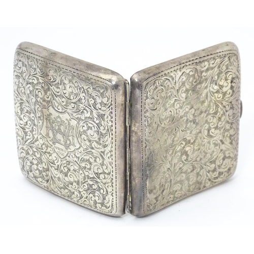 290 - A silver cigarette case with engraved acanthus scroll decoration and gilded interior. Hallmarked Bir... 