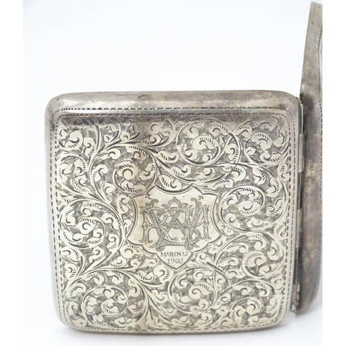 290 - A silver cigarette case with engraved acanthus scroll decoration and gilded interior. Hallmarked Bir... 