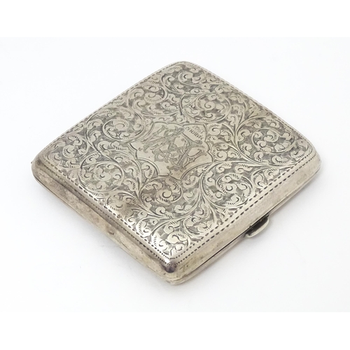 290 - A silver cigarette case with engraved acanthus scroll decoration and gilded interior. Hallmarked Bir... 