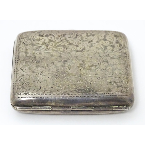 290 - A silver cigarette case with engraved acanthus scroll decoration and gilded interior. Hallmarked Bir... 