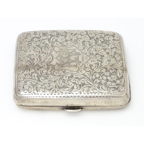 290 - A silver cigarette case with engraved acanthus scroll decoration and gilded interior. Hallmarked Bir... 