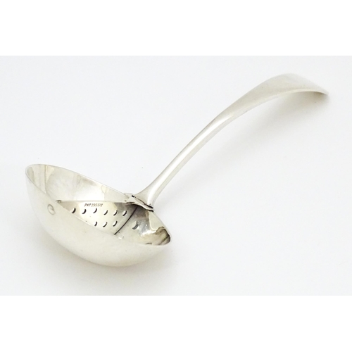 293 - A silver sauce ladle with central strainer section marked with Pat no 296612. ( Possibly for mint sa... 