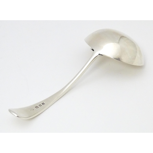 293 - A silver sauce ladle with central strainer section marked with Pat no 296612. ( Possibly for mint sa... 