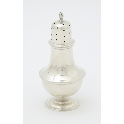 294 - A silver pepperette hallmarked Birmingham, 1913 maker William Aitken and stamped with retailers deta... 