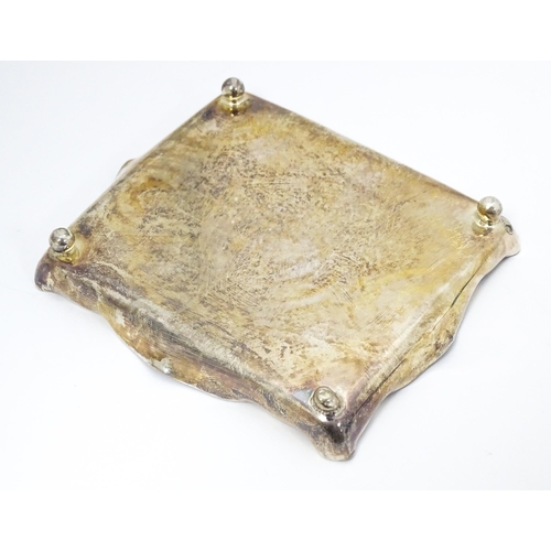 310 - A Victorian silver pin dish of rectangular form raised on four ball feet. Hallmarked London 1895 mak... 