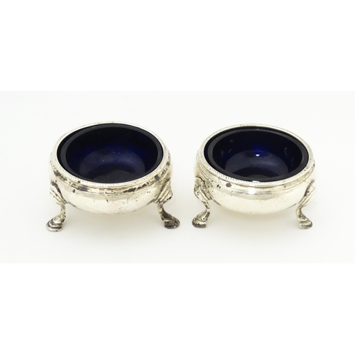 311 - A pair of Geo III silver salts with blue glass liners. London 1764 maker David Mowden 2 1/2