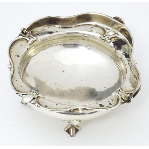 312 - A silver bonbon dish with swing handle hallmarked London 1919 maker E.A.D and stamped Watherston Lon... 