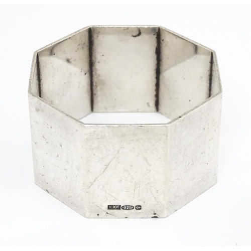 325 - A silver napkin ring of octagonal form