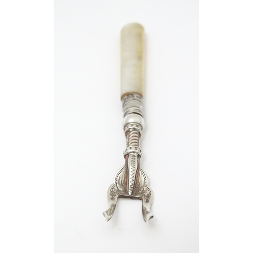 326 - A silver pickle fork with mother of pearl handle, hallmarked Birmingham 1915 maker William Devenport... 