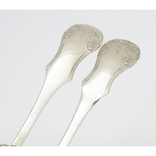 333 - A pair of Dutch silver small spoons with shovel formed bowls. Approx 3 1/4