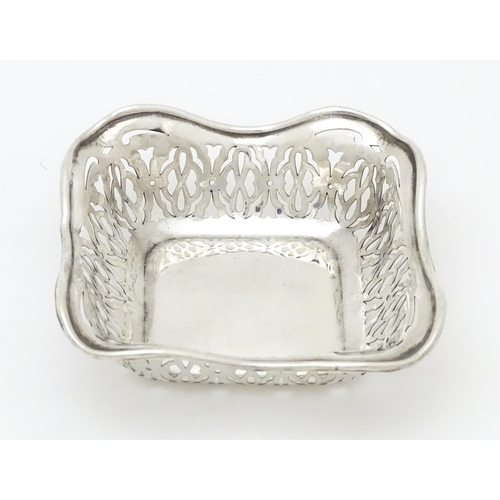 335 - A silver bonbon dish of squared form with pierced decoration, hallmarked Birmingham 1913 maker Sydne... 