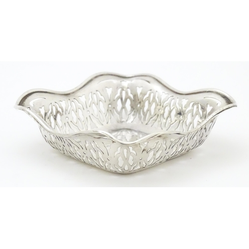 335 - A silver bonbon dish of squared form with pierced decoration, hallmarked Birmingham 1913 maker Sydne... 