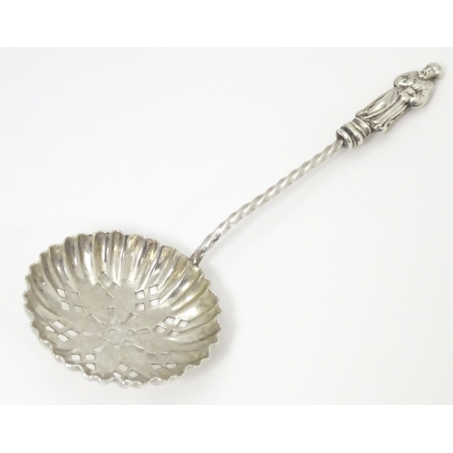 341 - A Victorian silver sifter spoon with apostle detail to handle. Hallmarked Birmingham 1895 maker Will... 