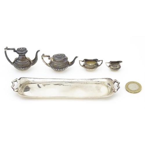 344 - A silver 5 piece miniature / dolls house tea set comprising tea pot, coffee pot, sugar bowl and crea... 