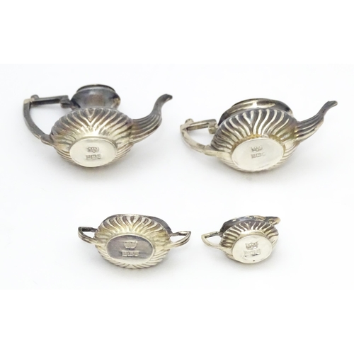 344 - A silver 5 piece miniature / dolls house tea set comprising tea pot, coffee pot, sugar bowl and crea... 