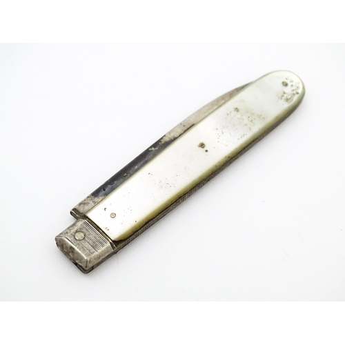 345 - A 19thC silver folding fruit knife with mother of pearl handle. Hallmarked Sheffield 1833 maker Nath... 