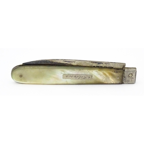 345 - A 19thC silver folding fruit knife with mother of pearl handle. Hallmarked Sheffield 1833 maker Nath... 