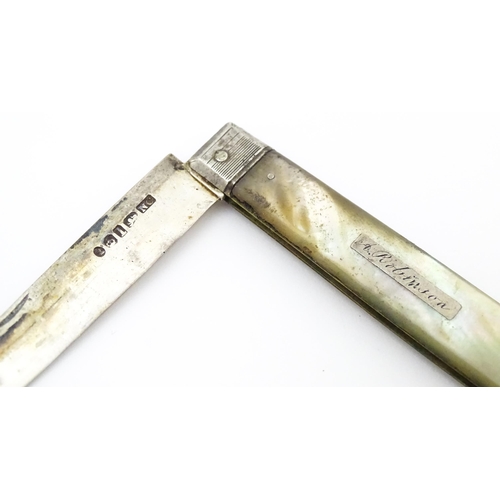 345 - A 19thC silver folding fruit knife with mother of pearl handle. Hallmarked Sheffield 1833 maker Nath... 